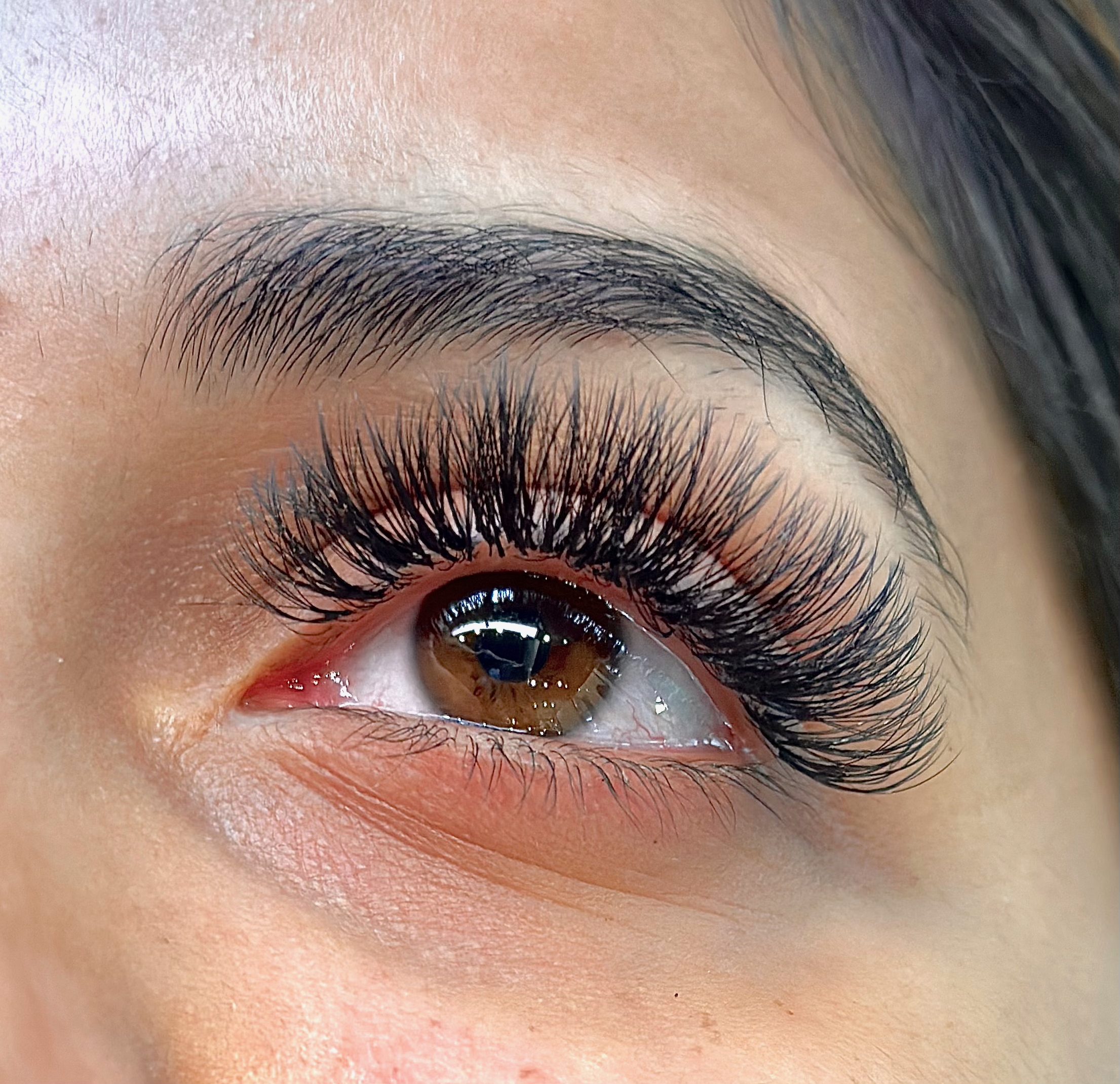 Pregnant woman with beautiful natural lash extensions at Étoile Lash Studio in Saskatoon